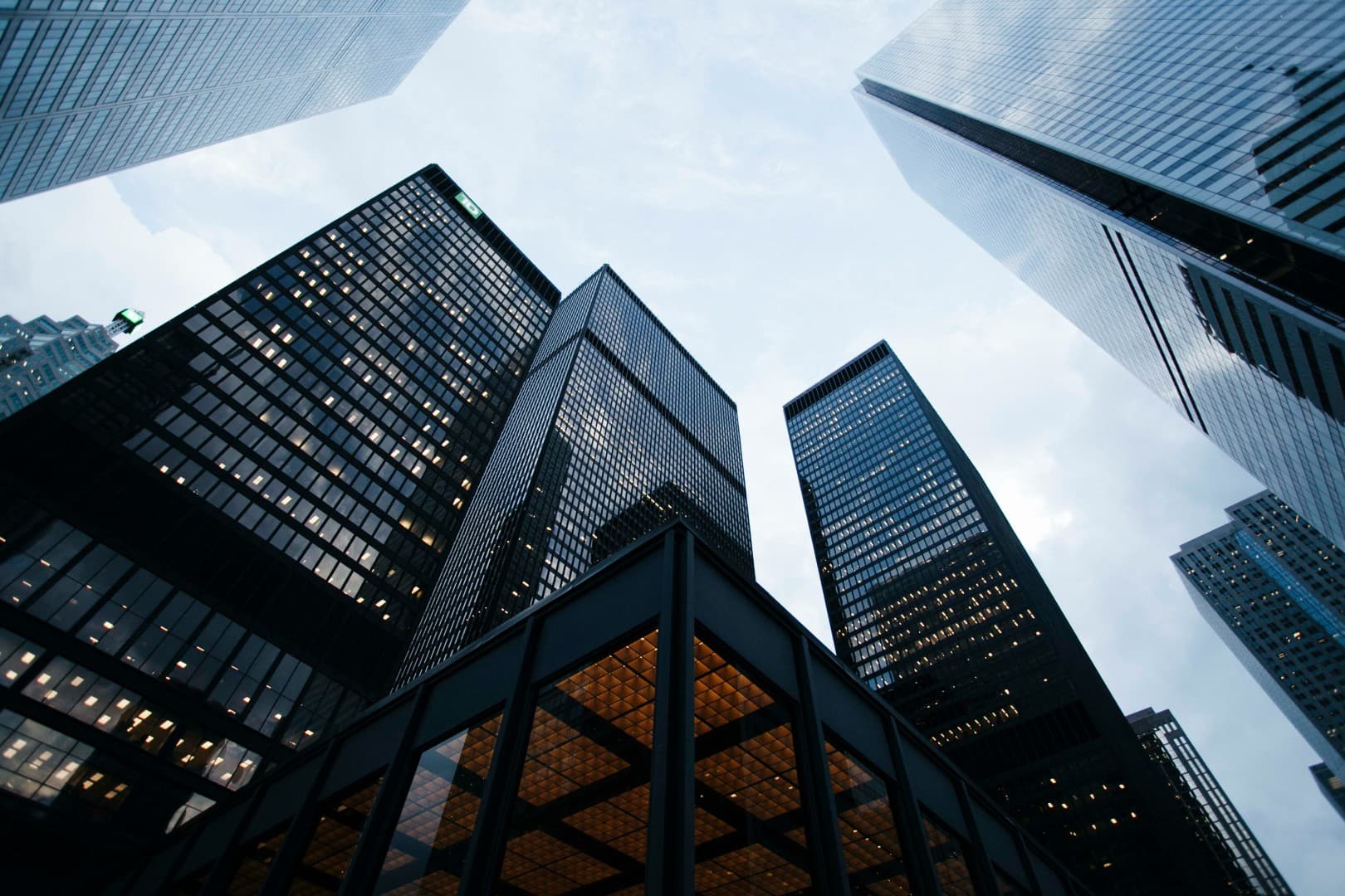 Modern commercial high-rise buildings representing Atlas Commercial Interiors