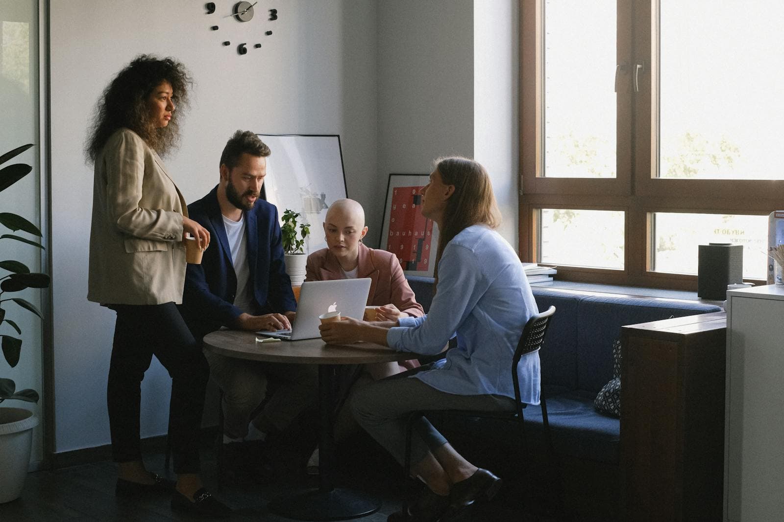 Consulting team in a casual work meeting executing campaign strategy