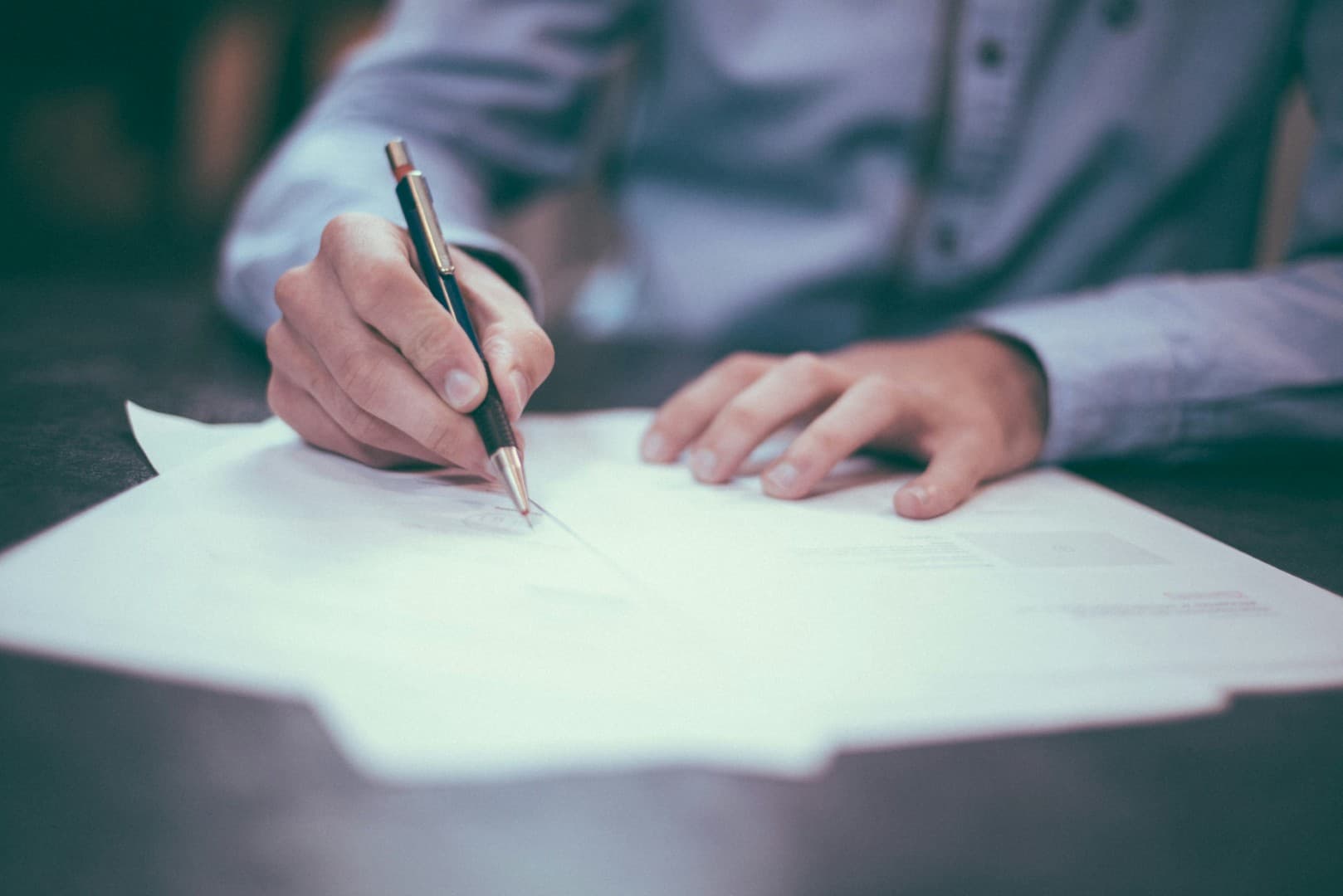 Professional signing important business documents and contracts
